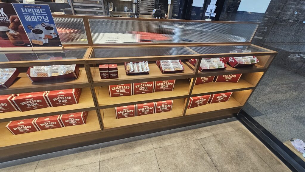 Bricksand Seoul gift box showcase with multiple tiers of red gift boxes stacked in Yeouido cafe