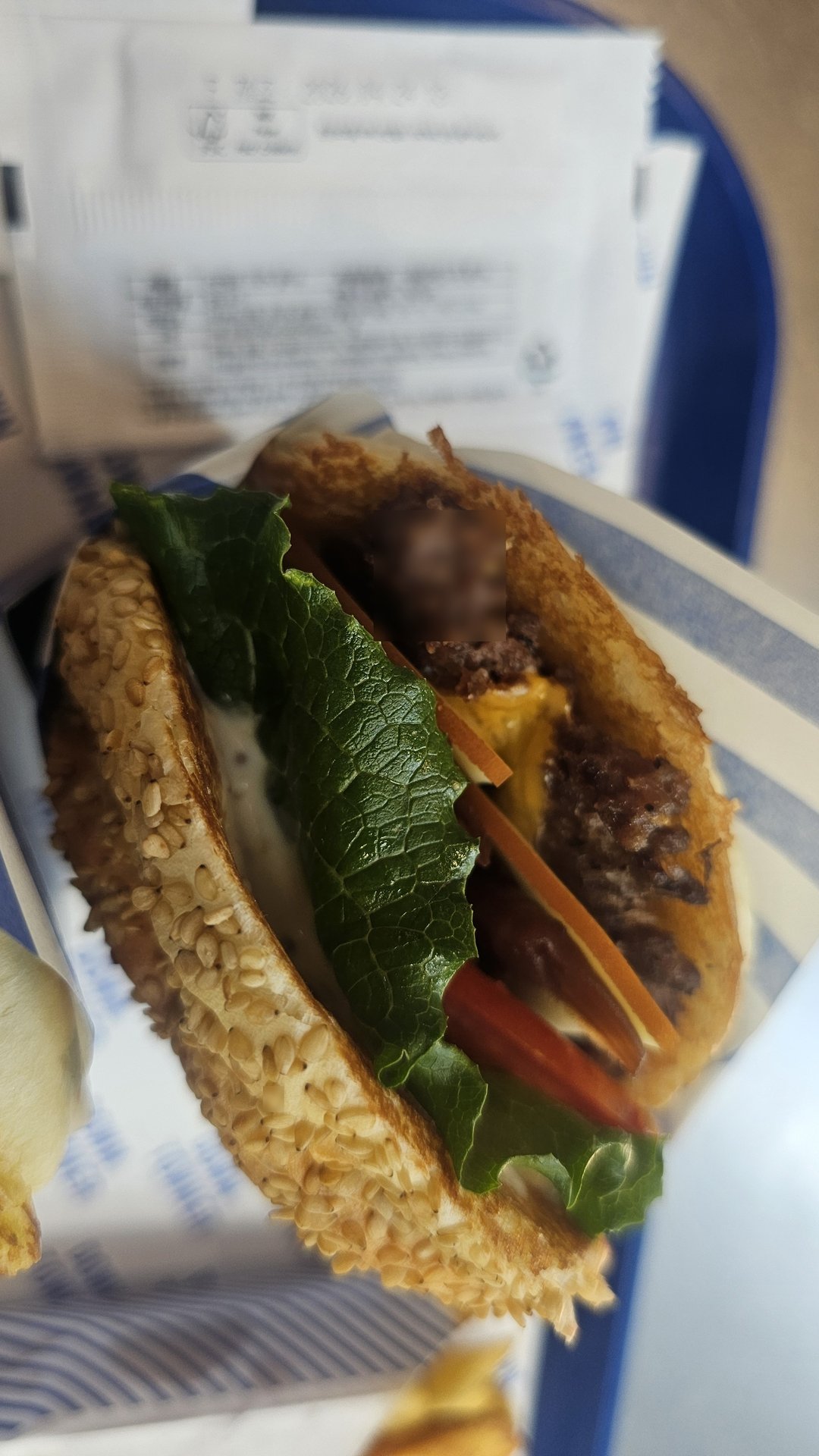 Double Cheese Truffle Burger cross-section showing thick smash patties, melted cheese, lettuce, and tomato on sesame bun