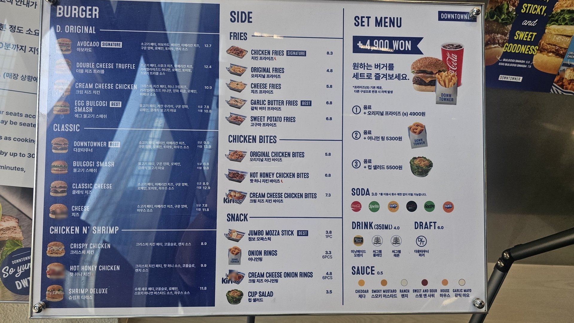 Downtowner Yeouido wall menu board showing full burger, side, chicken, and set meal prices including 4,900 KRW set options