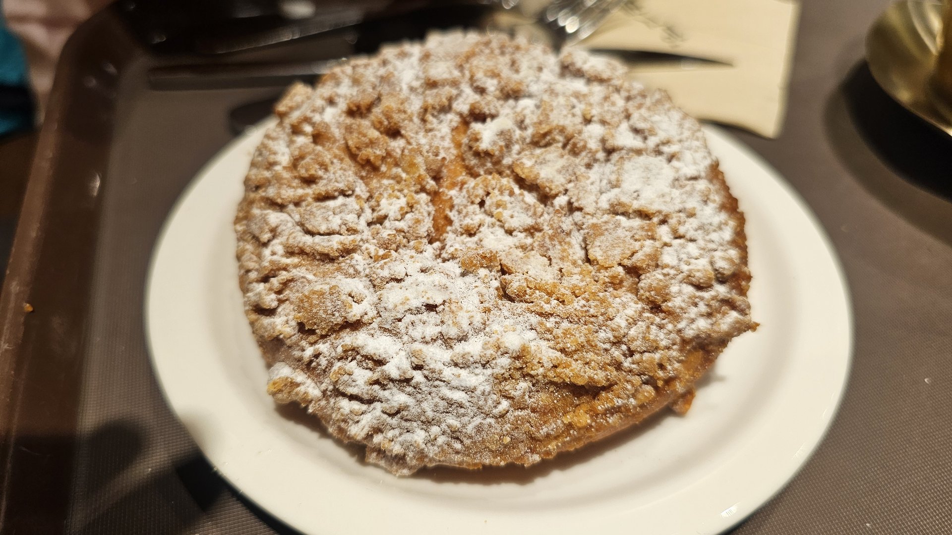 Soboro red bean cream bread on white plate at Patgodang dusted with powdered sugar