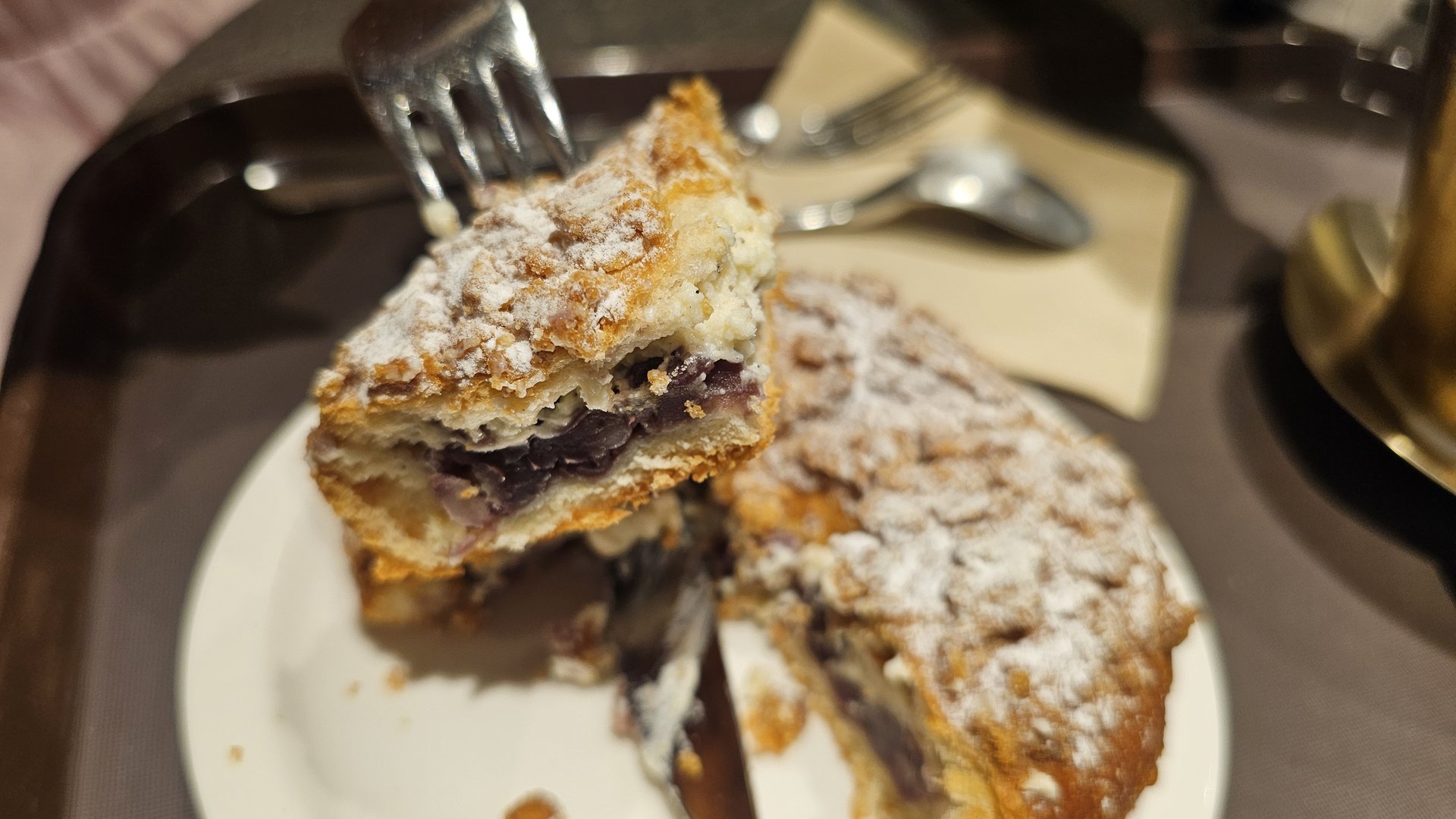 Cross-section of soboro red bean cream bread cut open with fork revealing smooth red bean cream filling at Patgodang