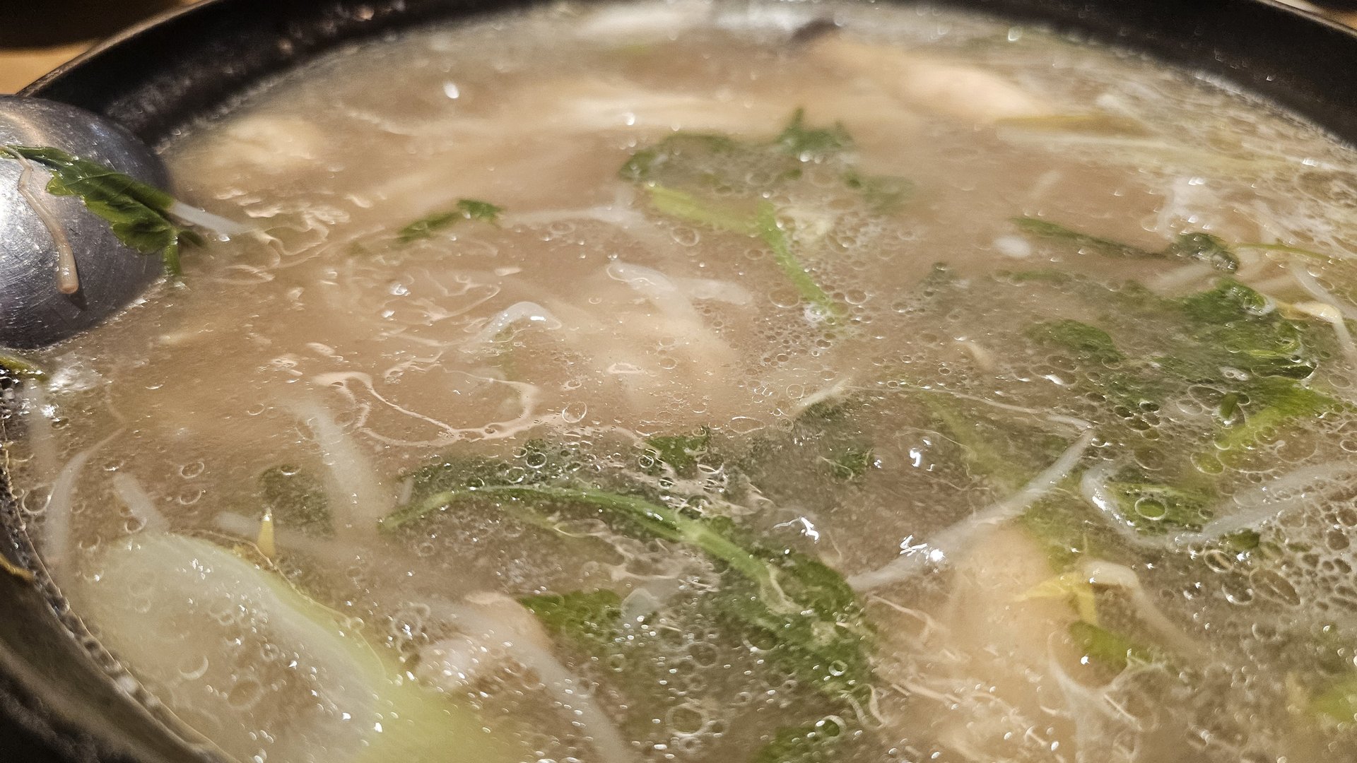 Final stage of the Jeil Myeonso shabu shabu with reduced broth and fully cooked ingredients