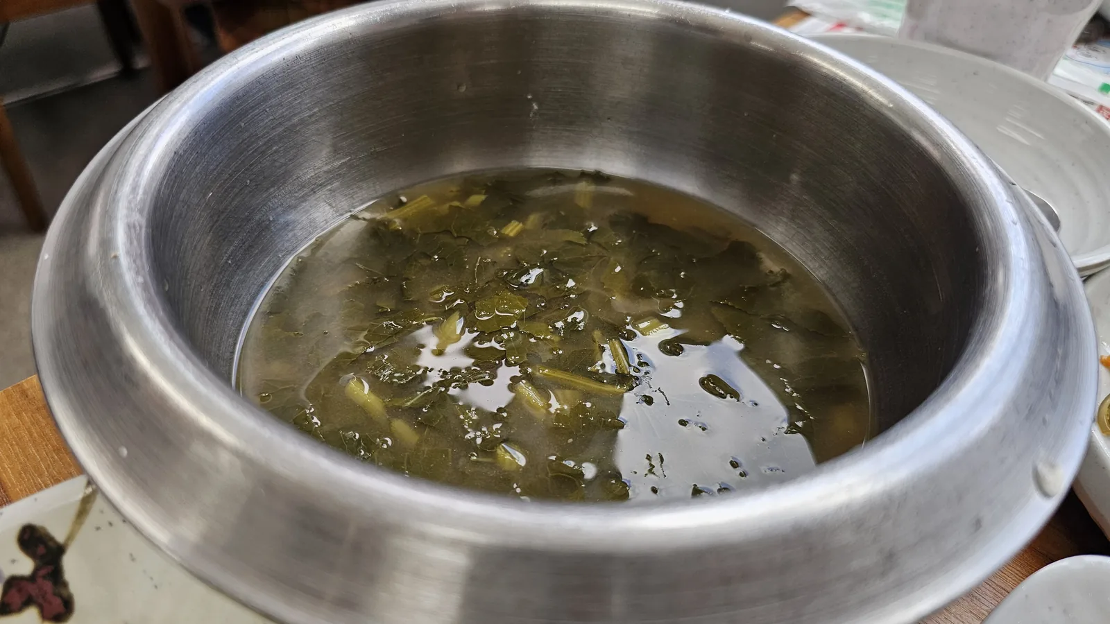 Siraegi doenjang soup at Nongbu Bapsang in stainless pot with dried radish greens in rich soybean paste broth